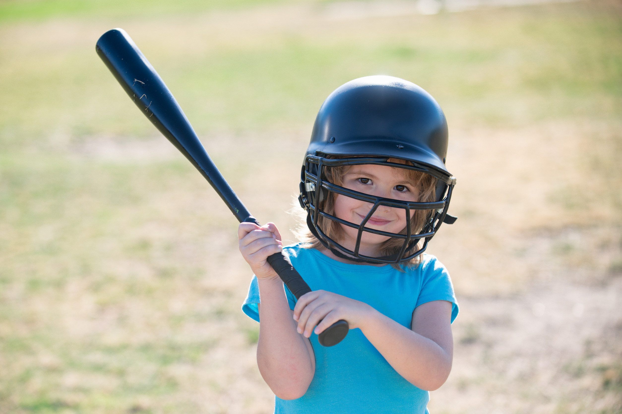 Baseball kid players in helmet and baseball bat in action. Baseball kid players in helmet and baseball bat in action